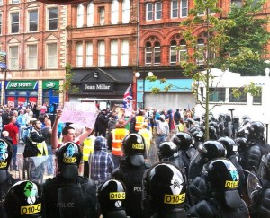 A tense stand off has developed between loyalists and PSNI riot squad officers