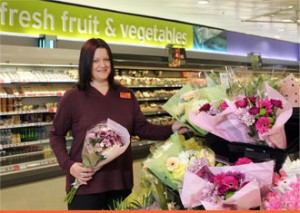 A member of staff working at Sainbury