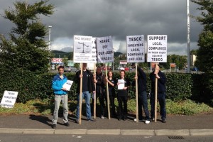 Shopfitting workers are picking Tesco HQ in Northern Ireland today over job losses