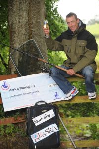 HOOK, LINE AND...WINNER. Mark O'Donoghue from Enniskillen fishes himself a £100k win on a National Lottery scratchcard