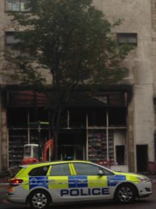 Police guard over the gutted B and M store in Belfast City Centre
