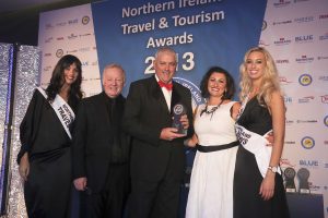 Mervyn McNeely from Stena Line is pictured receiving the Best Ferry Company award on behalf of Stena Line from Siobhan Bosket-McGuigan of sponsors Amadeus, TV personality and awards host Les Dennis and promotional girls Zara Shaw and Sarah Moore.