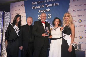 Mervyn McNeely from Stena Line is pictured receiving the Best Ferry Company award on behalf of Stena Line from Siobhan Bosket-McGuigan of sponsors Amadeus, TV personality and awards host Les Dennis and promotional girls Zara Shaw and Sarah Moore.