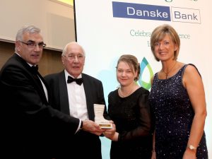 John Gordon MBE received the unsung hero awards. He is pictured receiving his award from sponsor Philip Rainey, Simple Power, Ruth Rodgers, editor of Farming Life, and Roberta Armstrong, Danske Bank
