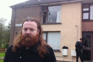 Richard Meenan outside the block of flats where a fire broke out