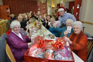 Strabane man Sacha Dolan, who won £76,908 on Lotto in May this year, donned his Santa hat to spread a little Christmas cheer when he visited local charity Strabane District Caring Services.  