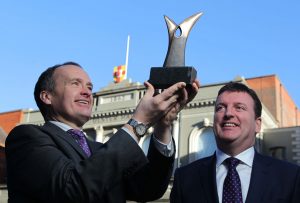 NITB Chairman, Howard Hastings (left) with a Northern Ireland Tourism Award and Paddy McKenna from Diageo NI at this years’ venue, the Ulster Hall.