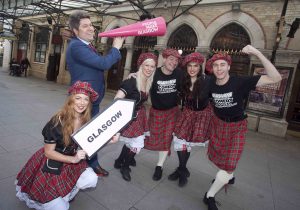 A GIGGLE IN GLASGOW: Bruce Devlin, well known Scottish comedian is pictured with his troupe of dancers who are promoting the Glasgow International Comedy Festival 