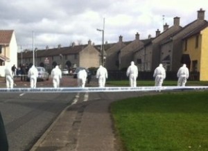 Forensic teams comb the scene of Saturday