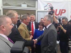 Fancy meeting you here? Nigel Farage and Peter Robinson shake hands at Balmoral Show
