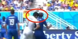 Luis Suarez bites Italy's Giorgio Chiellin