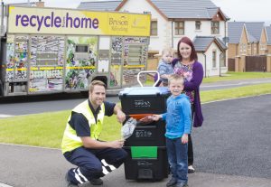 L to R Gareth Townsley from Bryson Recycling with Oliver Shields, Danielle Shields and Ethan Shields put Bryson Recycling’s new ‘Wheelie Box’ to test.