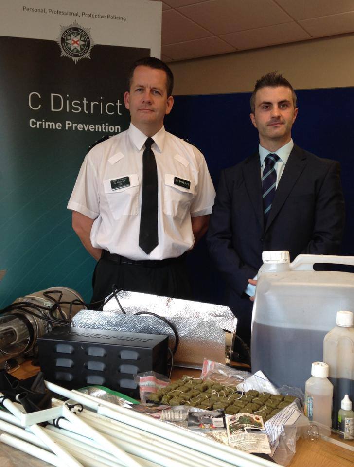 Chief Inspector Gerry McGrath with a detective put on show drug paraphernalia seized in Comber