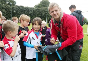 Oliver Tweed (7) from Belfast along with other young players met Ulster Rugby hero Chris Henry during this year’s Centra Ulster Rugby Summer Camp at Stormont Sports Pavillion.  