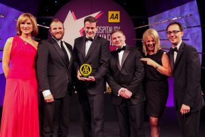 L-R: AA Hospitality Awards host, Fiona Bruce; Gavin Carroll, general manager, The Merchant Hotel; Michael Patterson, manager, The Cocktail Bar at The Merchant Hotel; Michael Sullivan, deputy general manager, The Merchant Hotel; Kirsten Grant Meikle, prestige director of The Balvenie and Simon Numphud Head of AA Hotel Services.