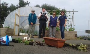 Charity volunteer, Billy Nicholson with Constable Gillies, York Road NPT, Joan Nicholson, Volunteer and Helen Tomb, Project Manager, The Conservation Volunteers.