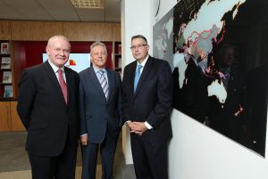 First Minister Peter Robinson and deputy First Minister Martin McGuinness are pictured with Paul Terrington, PwC Regional Chairman.  PricewaterhouseCoopers (PwC) is creating 807 jobs contributing £16 million annually to the economy. Pic: Kelvin Boyes/PRESSEYE