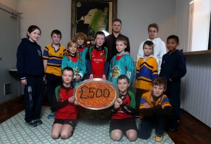 Pictured left to right: Bangor Rugby Club players , City of Belfast Swimming Club players, Junior Belfast Giants players, Holywood Rugby Football Club players join Luke Wolsey, MD of Little Wing Pizzeria at the new Holywood Little Wing.