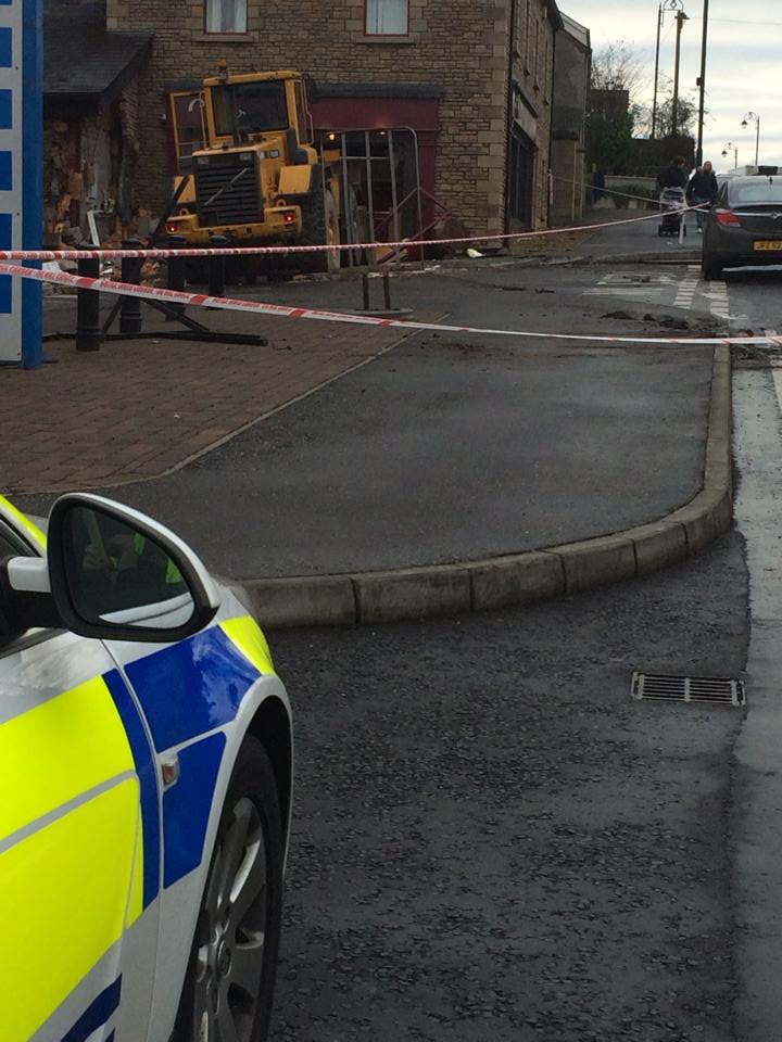 The scene this morning in Co Tyrone after a digger was used to ram an ATM machine