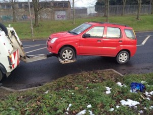 A Suzuki car is towed away after it was to have no valid car insurance