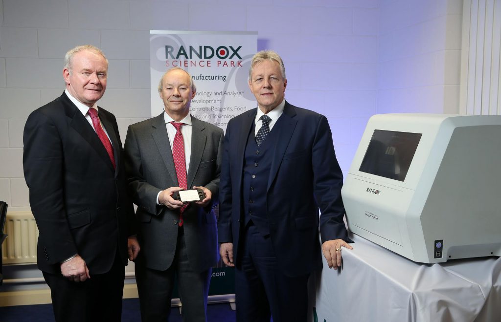 First Minister Peter Robinson and the deputy First Minister Martin McGuinness are pictured with Managing Director of Randox, Dr Peter FitzGerald, after announcing that the global diagnostics is to create 540 quality jobs over four years. PICTURE: KELVIN BOYES/PRESSEYE