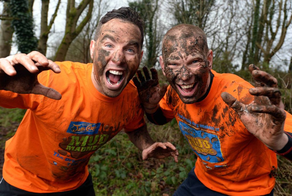 MUDDY GOOD FUN... Rugby legend Paddy Wallace gets jaffa-caked in mud alongside the reigning McVities Jaffa Cakes Mud Madness champion Keith Clarke ahead of this years race. 