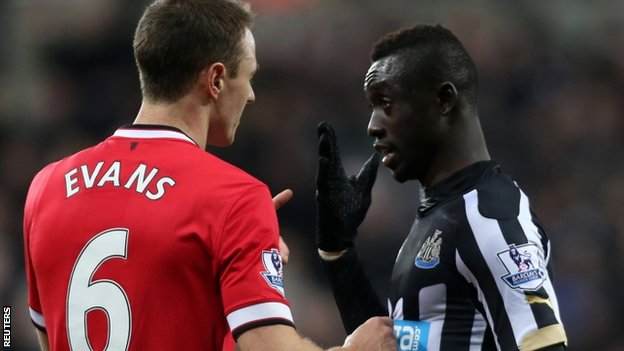 Jonny Evans and Papiss Cisse square up at Old Trafford now charged with spitting