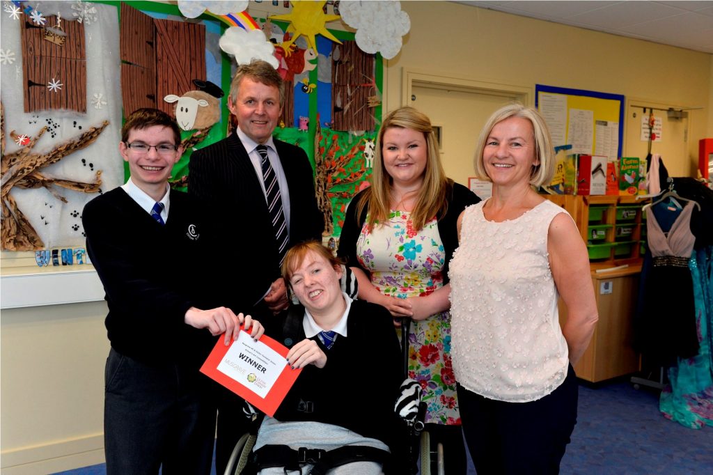 Pupils from Clifton Special School, Bangor are celebrating along with their teacher Mrs Sinnamon (right) after being announced as the Special Schools category winner in Musgrave NI and Ulster FarmersÕ Union art competition. Mrs SinnamonÕs class impressed judges with their creative art display on ÔSeasons of FarmingÕ and pupils Matthew Watters and Brooke McClenaghan were presented with their £200 prize from UFUÕs Barclay Bell and MusgraveÕs Jen Higgins.