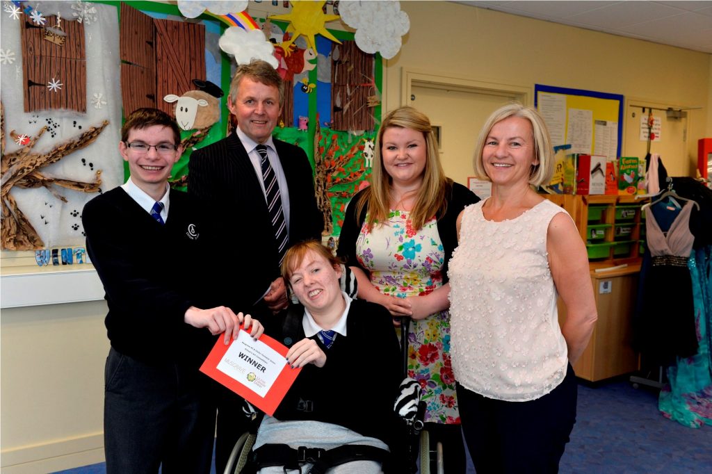 Pupils from Clifton Special School, Bangor are celebrating along with their teacher Mrs Sinnamon (right) after being announced as the Special Schools category winner in Musgrave NI and Ulster FarmersÕ Union art competition. Mrs SinnamonÕs class impressed judges with their creative art display on ÔSeasons of FarmingÕ and pupils Matthew Watters and Brooke McClenaghan were presented with their £200 prize from UFUÕs Barclay Bell and MusgraveÕs Jen Higgins. 