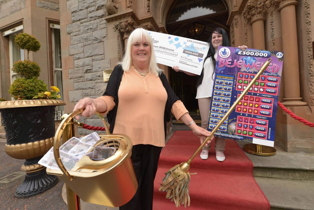 CLEANING UP: (l-r) Belfast cleaner Maureen Wilkinson (58) celebrates with her daughter Kimberley McCaughey at the five-star Culloden Hotel after scooping a massive £300,000 on a National Lottery Scratchcard. Maureen, from the Cregagh area in the east of the city, cleaned up when she matched three figures on the National Lottery Bejeweled Scratchcard that she purchased from her local Mace store in Greenway. The Bejeweled Scratchcard costs £3 and offers a 1 in 3.71 overall chance of winning a prize, which can range from £3 to the top prize of £300,000. Maureen has no plans yet on how shell spend all the money but already has her eye on a new three-piece suite for her home and, although she doesnt drive, a new car for the family.