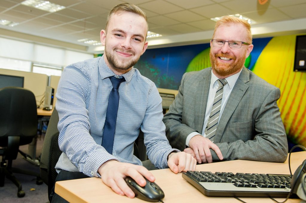 : L to R Michael Moloney, from North Belfast and Stephen Hillis from Ingeus mark a major milestone for Firstsource Solutions. Michael is the 100th employee to be recruited through the Steps 2 Success programme, which is designed to help jobseekers build the skills and experience needed to find and keep a job.