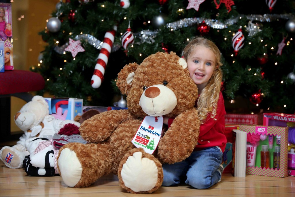 Little Cerys ONeill (4), gets ready to donate a toy to the Cash for Kids festive Mission Christmas toy campaign at the Stena Line Victoria Terminal 4 drop off point in Belfast.