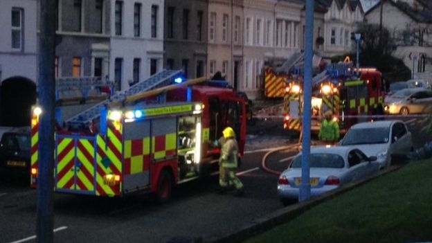 The scene in the early hours of this morning when the fire engine crashed into cars and a house on Larne's Glenarm Road