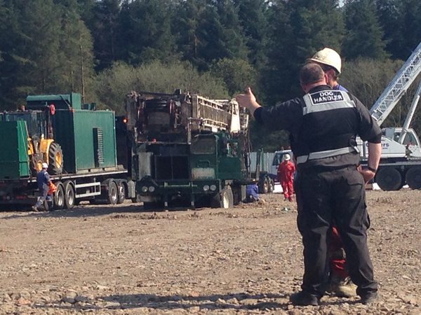 WHACK WHACK OOP...Huge oil rig brought into drill at Woodburn Forest sinks into the soft ground beneath