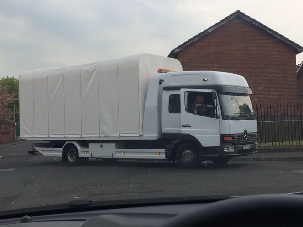 A police forensic truck removes Dan Murray's Ford Focus car a detailed examination