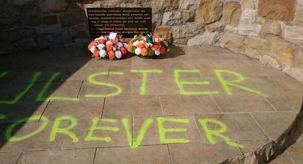 Graffiti daubed on republican memorial stone at Milltown Cemetery in west Belfast