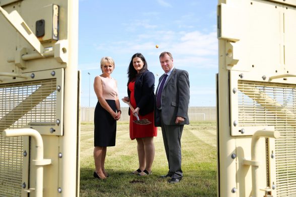 Justice Minister Claire Sugden cuts the first sod in preparation for the construction of a new cell block at Maghaberry Prison. She is pictured with Sue McAllister, Northern Ireland Prison Service Director General and Stephen Davis, Governor of Maghaberry. Picture by Kelvin Boyes / Press Eye.