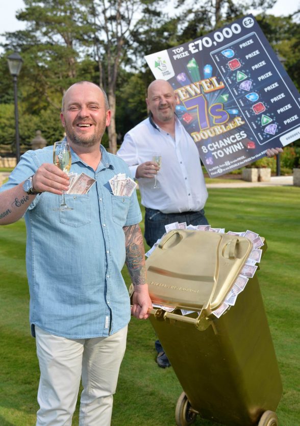 NEVER BIN BETTER:  County Down bin men Frank McCormick(44) from Newtownards and Stephen Inglis (46) from Bangor celebrate their wheelie good fortune after collecting a tasty £70,000 from a National Lottery Scratchcard.  The winning Jewel 7s Doubler 