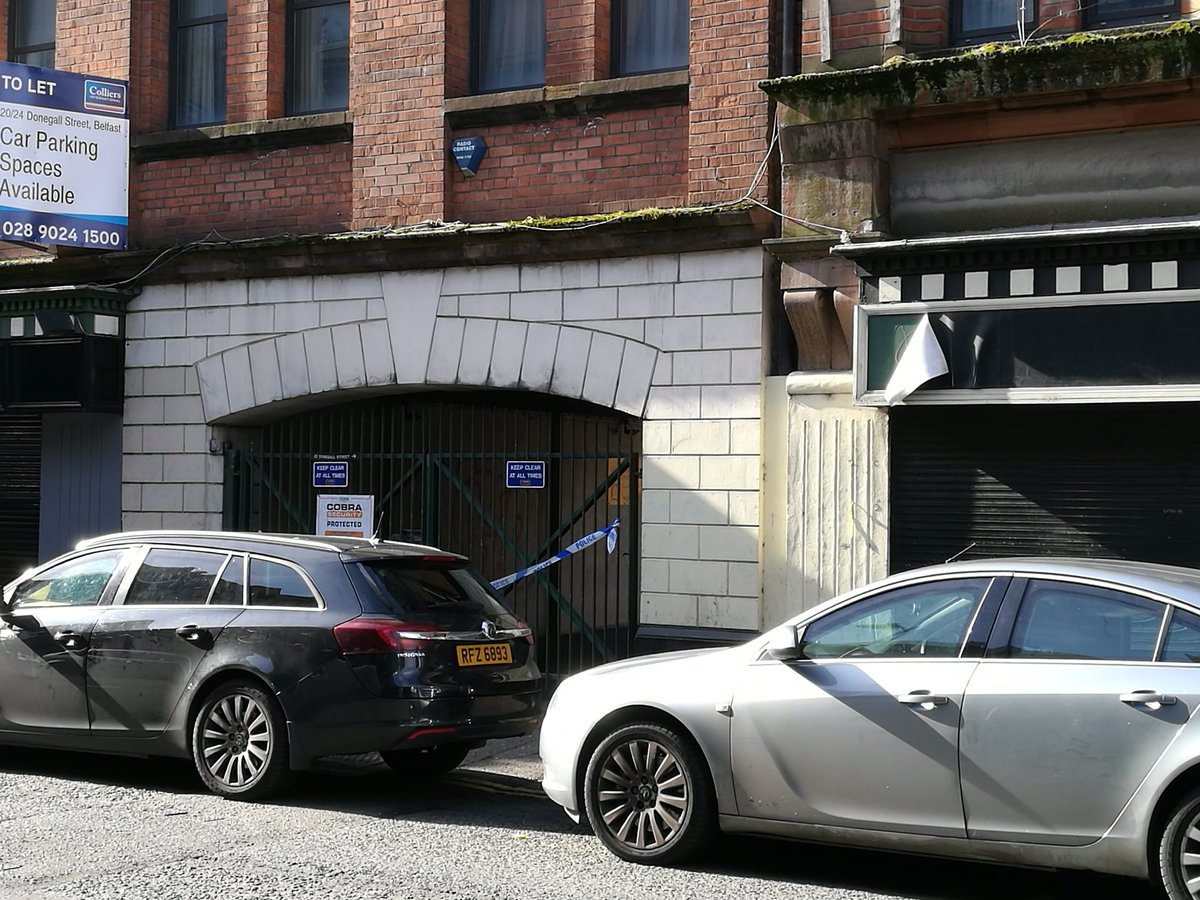 Police at the scene where a man's body was found in lower Donegall Street last night