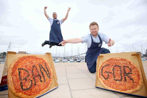 Darren Colgan (front), owner of the newly opened Bangor Four Star Pizza store, was at Bangor Marina with team member, Bela Deak Vesci, to celebrate the opening of his store which also has a sit-in area. 